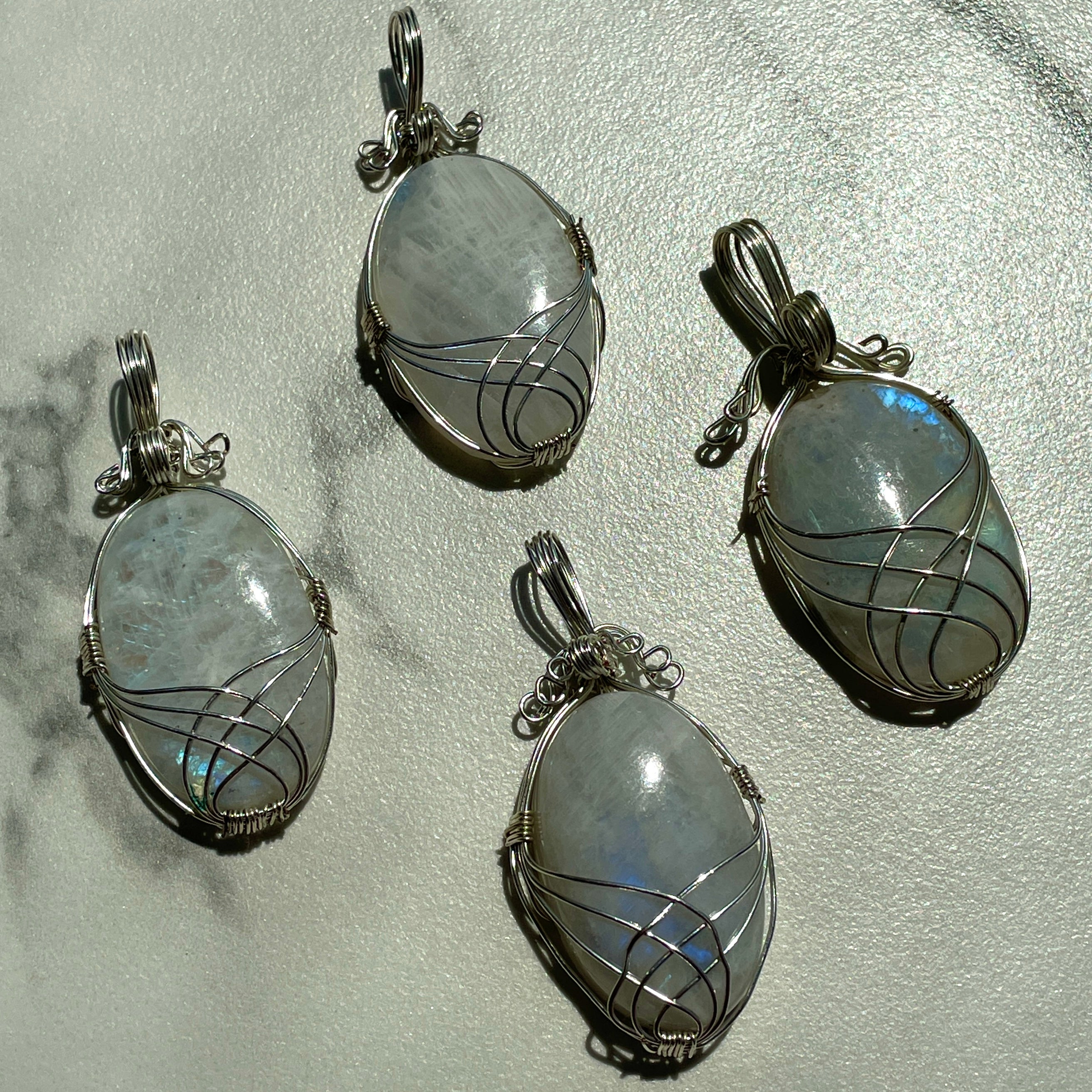 Wire Wrapped Cabochon - Rainbow Moonstone Wire Wrapped Cabochon - Rainbow Moonstone